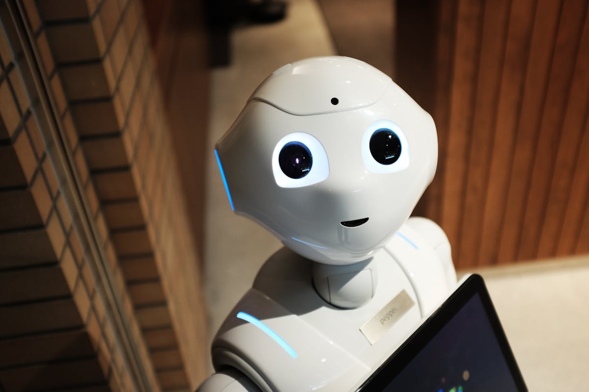Friendly white AI assistant robot in a modern setting